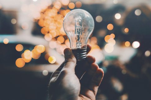 fachy-marin-Wm7-Z1ZOi0Y-unsplash man holding a light bulb
